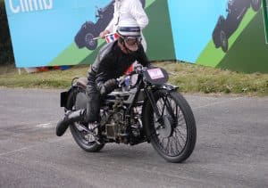 Photo of an individual at the modern-day Kop Hill Climb re-creating the 1925 record run by Freddie Dixon