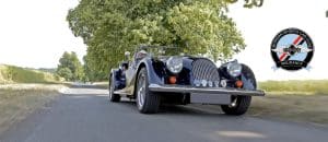 Morgan Sports Car Club Insurance - black Morgan driving on road