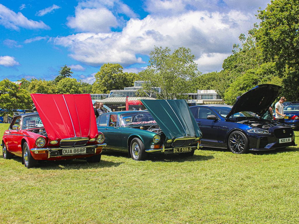 3 Jaguars with bonnets up at Simply Jaguar in Beaulieu