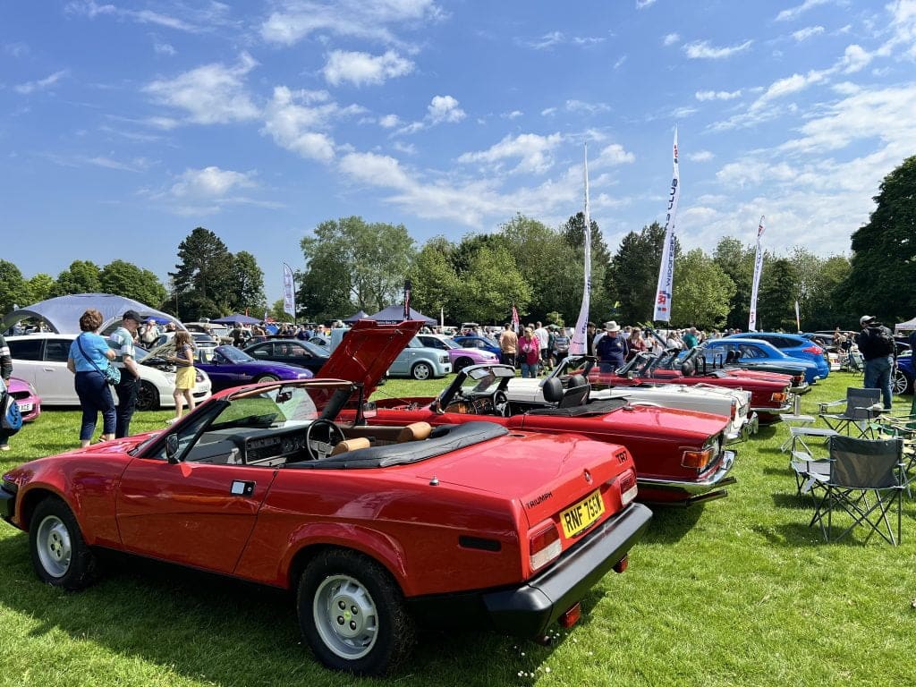 Red Triumph TR7 on loan from TR Register Car Club attends car show