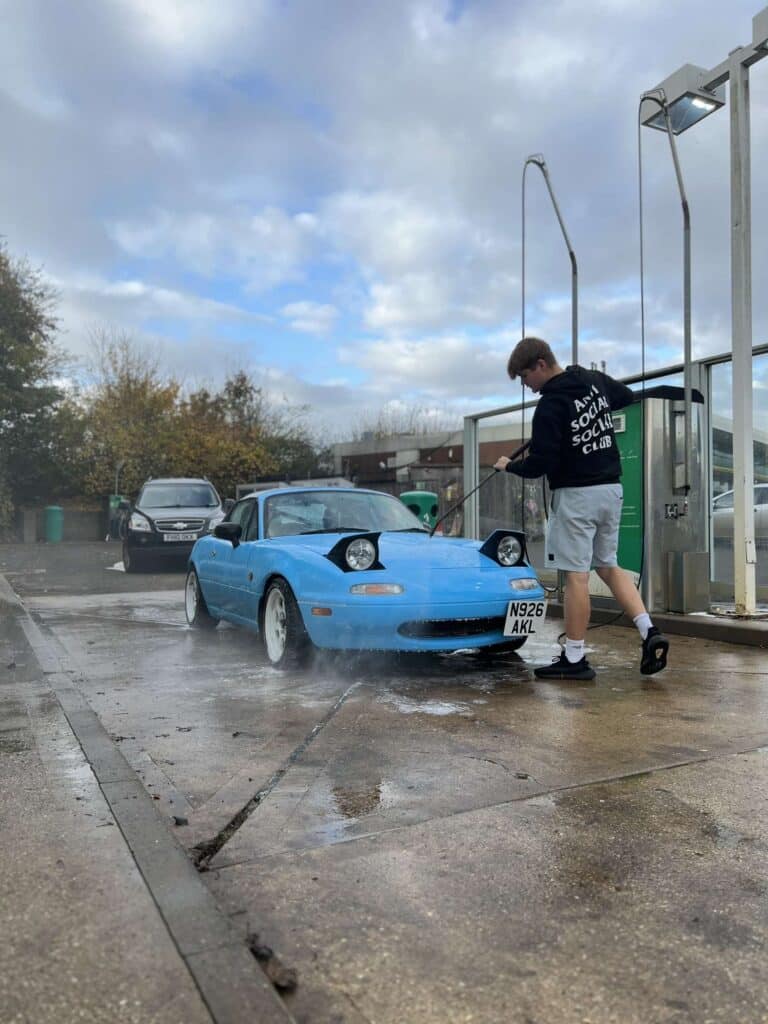 Blue 1996 MX-5 at car wash