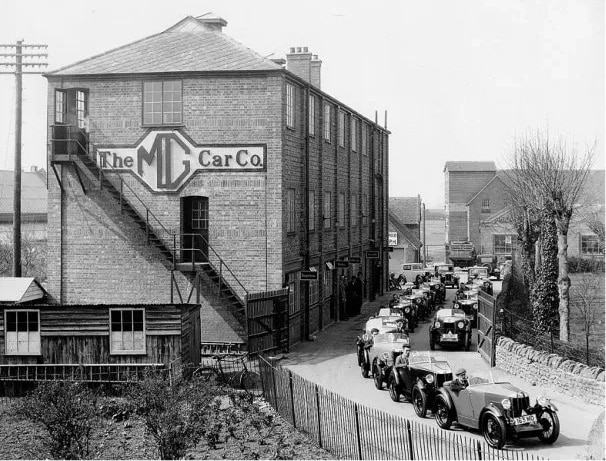 MG TD Part 2 - Black and white photo showing M-Type Midgets leaving the Abingdon factory in 1930.